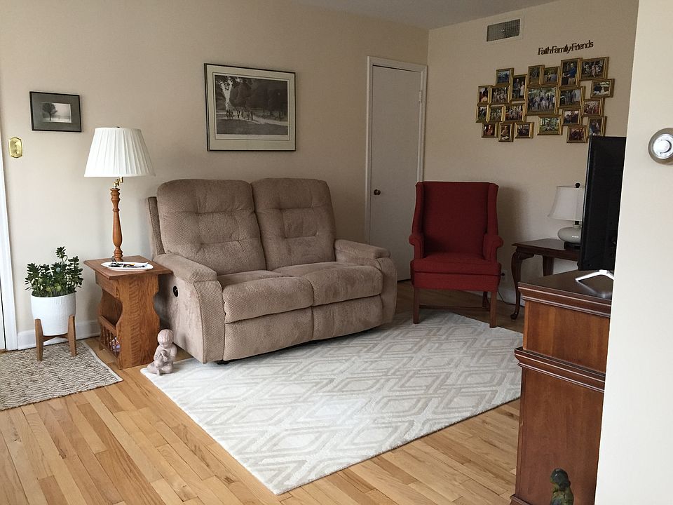 Living room with large coat closet.
