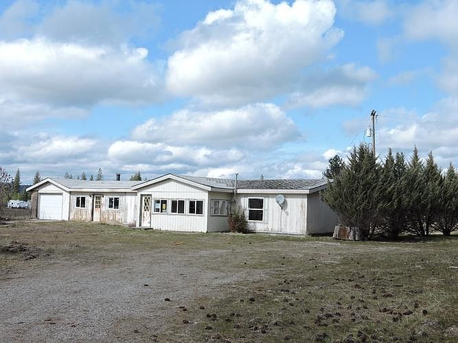 DISTANT VIEW OF SUBJECT FROM DRIVEWAY ACCESS