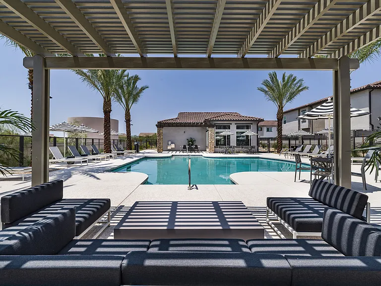Experience the ultimate in luxury living with Aster Ridge's resort-style pool and shaded pergola. Perfect for your next staycation.