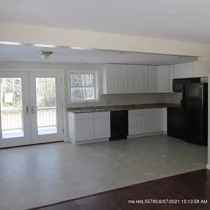 Kitchen / Living Rm showing Patio doors to the deck and backyard.