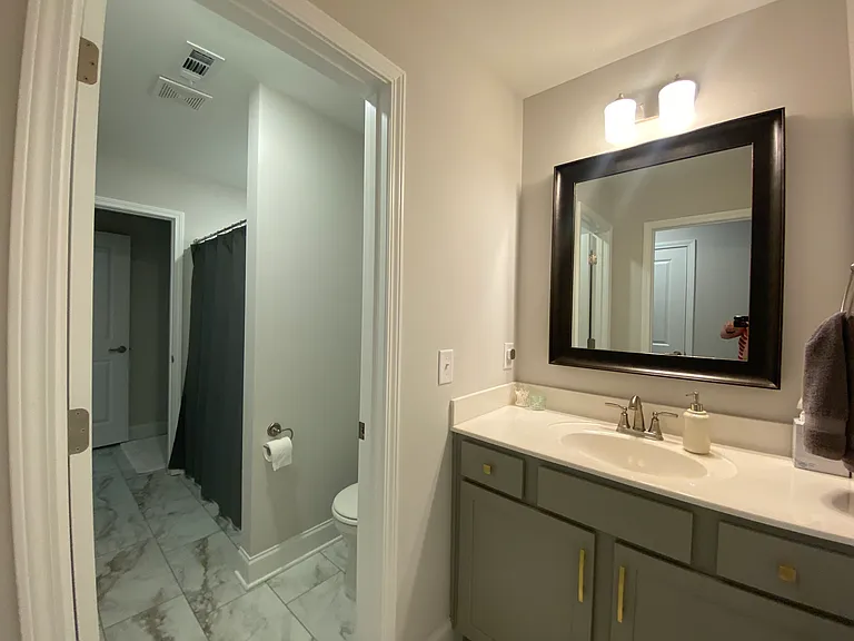 Jack & Jill bathroom. Shared tub/shower and toilet. Sinks are private with doors