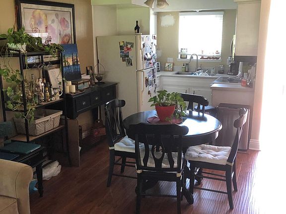 Kitchen and Dinning Area. Some of current tenant's furniture is shown. Please excuse the clutter.