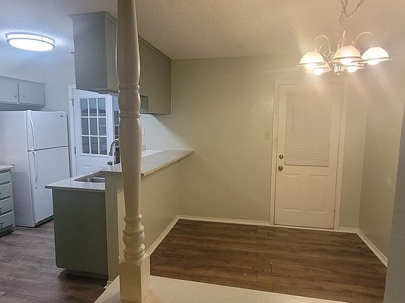 living room looking into kitchen and dining room