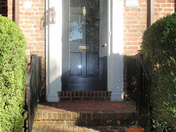 Lovely entrance to this brick and slate colonial