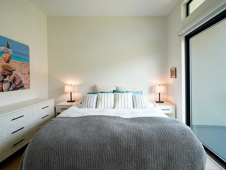 Primary bedroom with balcony