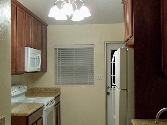 View of kitchen from bar top in living room