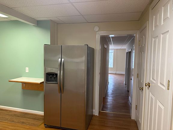 hallway to bedroom, closets, and living room