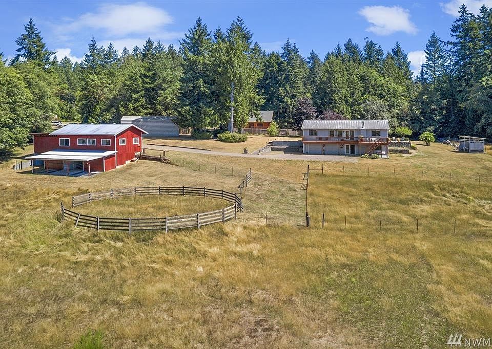 Welcome to this truly unique property! 4.9 wide-open acres, with picturesque red barn plus so many other hard-to-find features! And at the end of a private lane...totally secluded!
