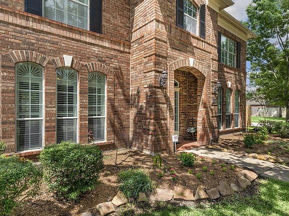 A stately brick exterior with accent shutters and landscaping with mature trees shades the yard and offers great curb appeal!