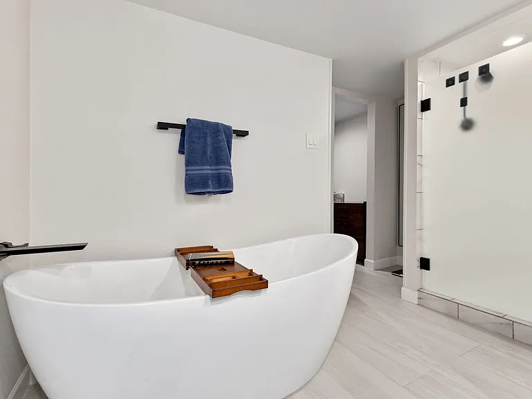Bathroom featuring a tub to relax in
