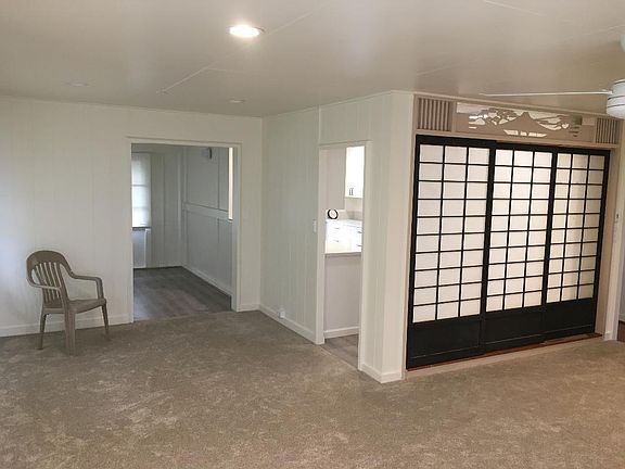 Living room toward kitchen and den.