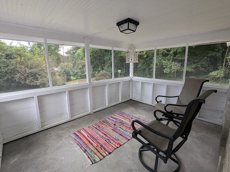 Screened porch adds 100 square feet of seasonal living space. Accessible from exterior stairs and upstairs living area.