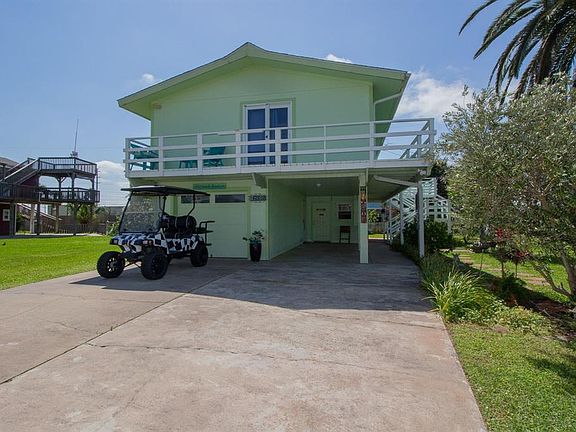 One bedroom/bath upstairs, one bed/bathroom and bonus room/golf cart storage and additional storage downstairs. Lots of parking...double driveway...