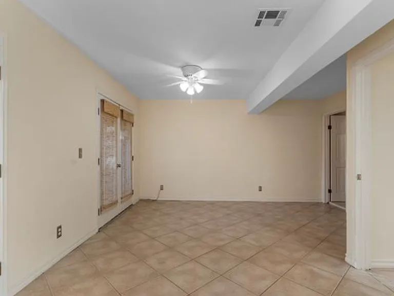 Ground level 2nd living or 3rd bedroom. Access to outdoor patio, Private full bathroom.
