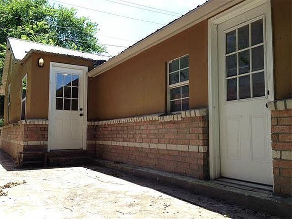 Back of house. Far right door leads to small storage room.