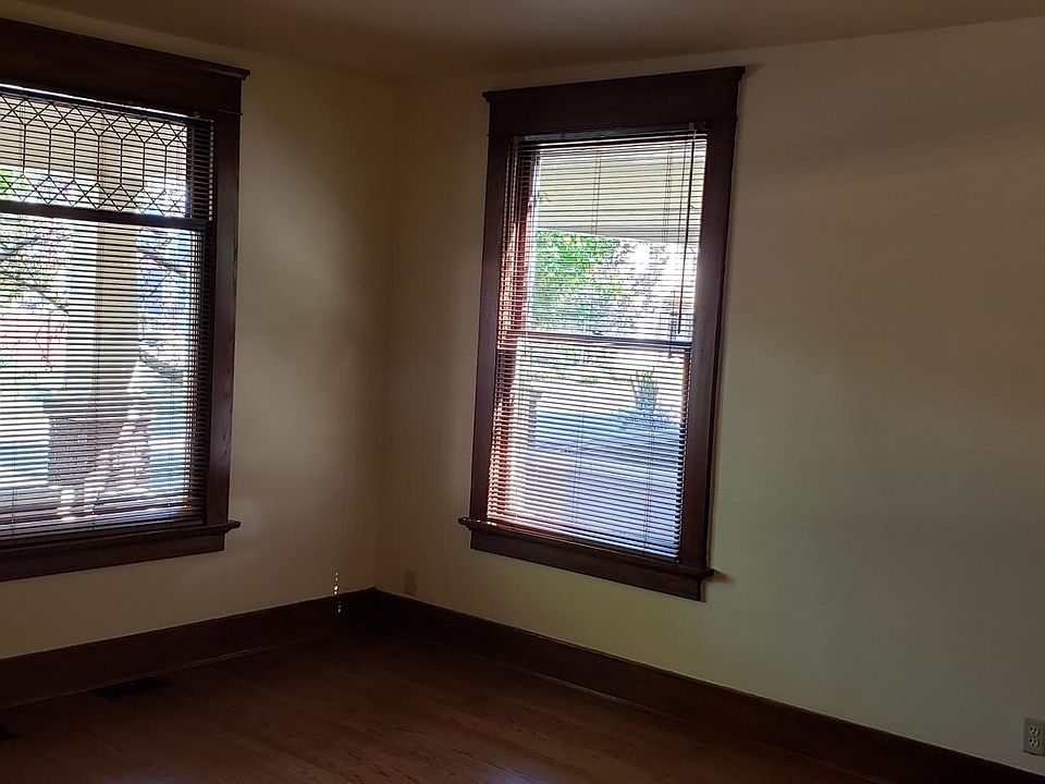 Living room featuring leaded glass transom window.