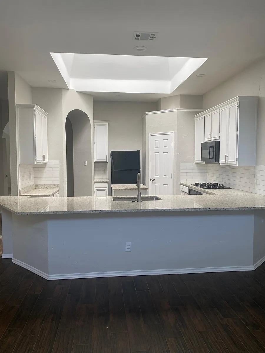 Light and bright kitchen with skylight. - 10108 Forrest Dr