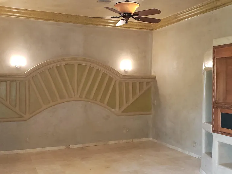 Large Master Bedroom with Nice Sitting Area, wall mount for TV, and Desk