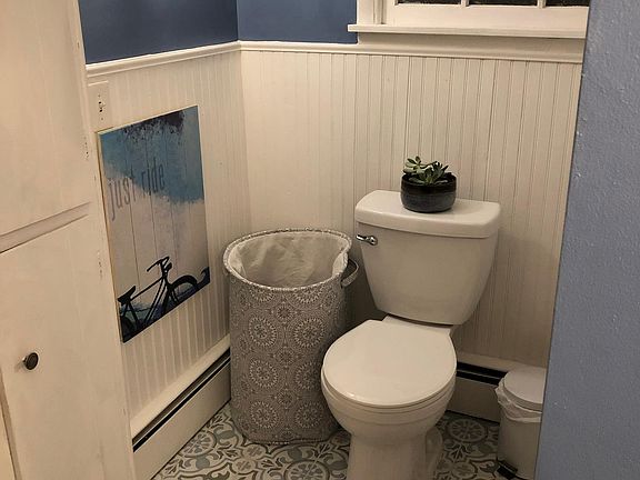 Bathroom with new tile and vanity. Built in cabinets.