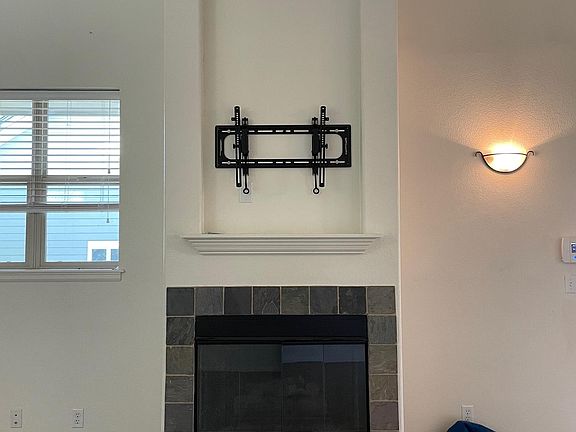 Tv mount and electric gas fireplace.