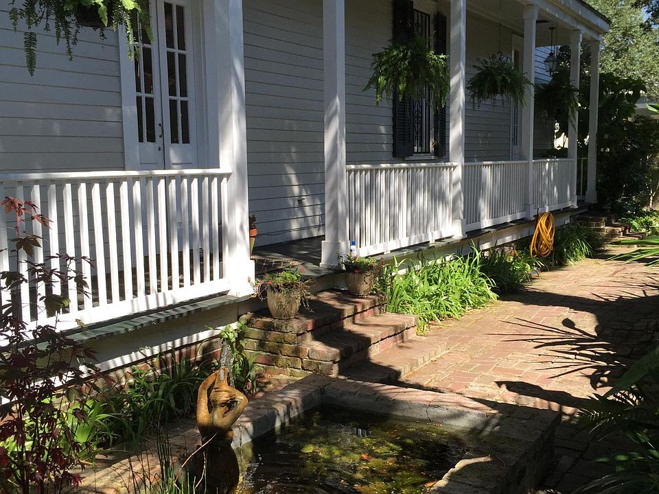 Front Door and fish pond with fountain.
