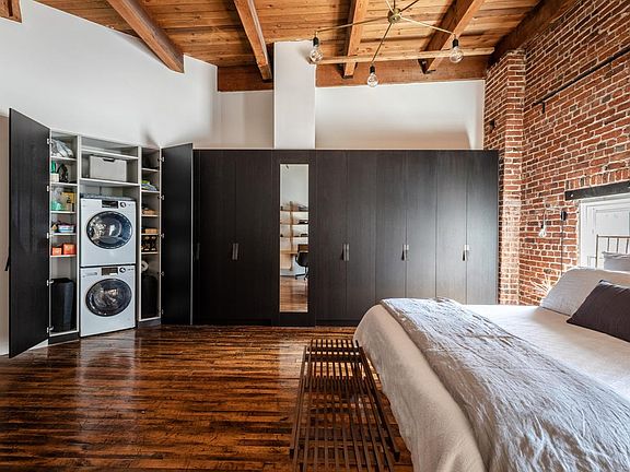 In-unit Laundry concealed in built-in cabinetry