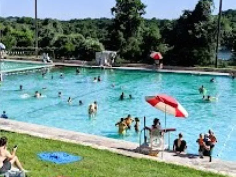 This springfed pool is ten minutes from the house and next to Lady Bird Lake and Trails. The pool features lap swim lanes at one end and a beach end at the shallow end. Entry Fee Applies