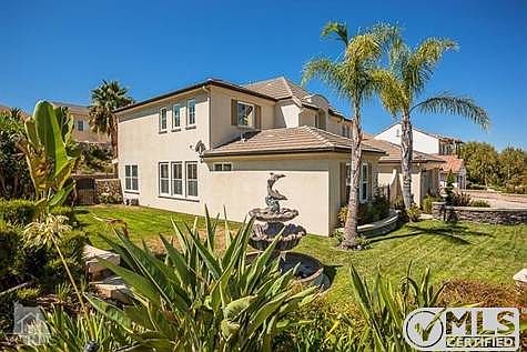 Dolphin fountain in front yard.