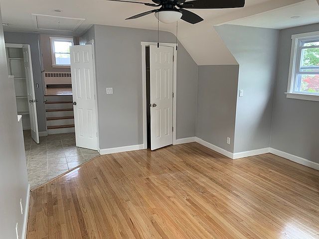 Oversized living room with view of the raised bedroom and 2-hall closets and 1-closet in the living room.