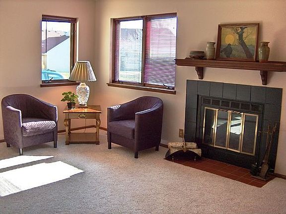 South facing living room with fireplace.