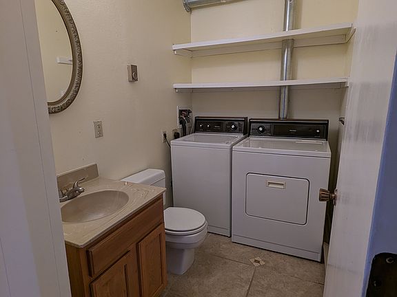 Downstairs 1/2 bath with full-size washer and dryer