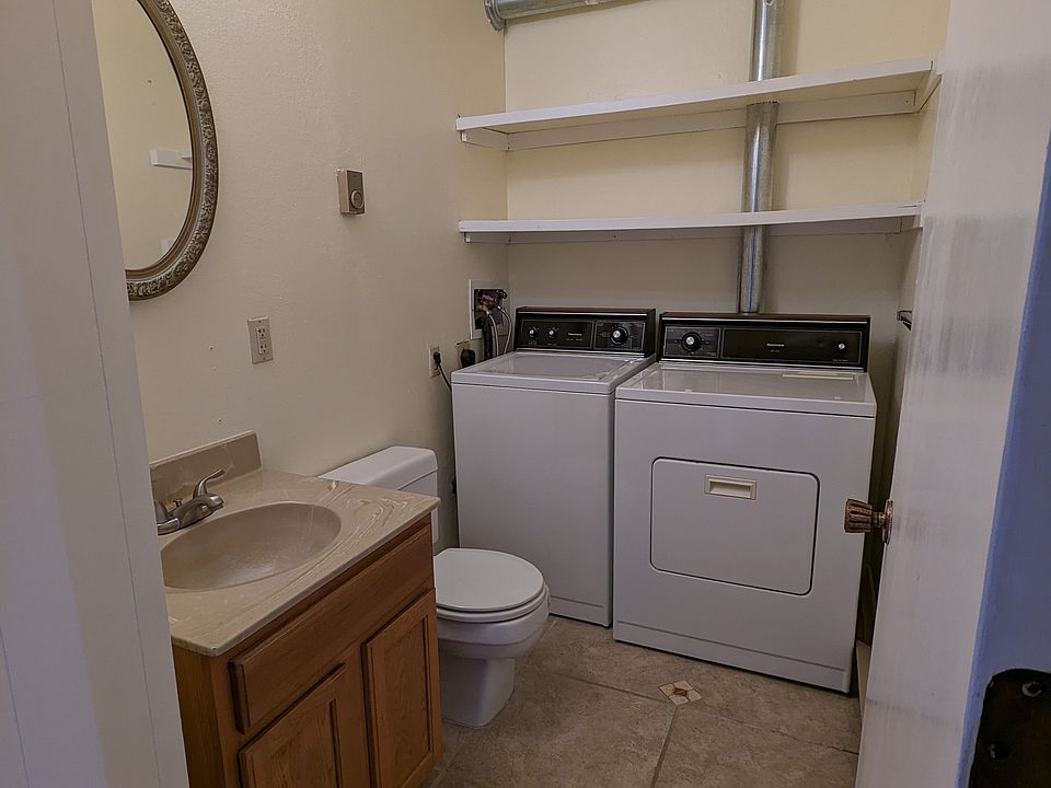 Downstairs 1/2 bath with full-size washer and dryer
