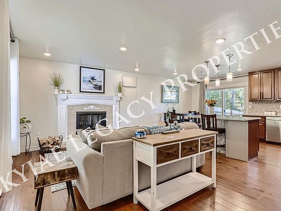 Another view of the living room, dining room and kitchen.