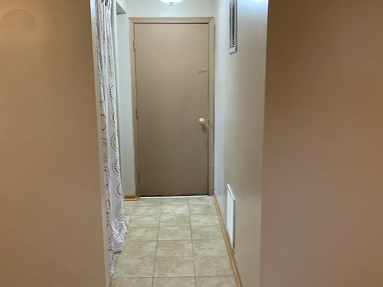 Basement Hallway and entry to the garage.