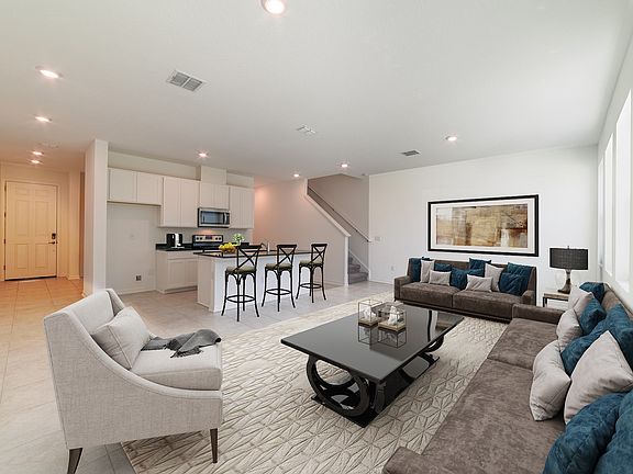 Prepare family dinners at the kitchen island without missing the conversation in the family room.