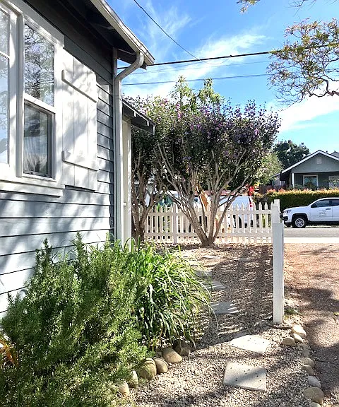 Side of house/driveway looking toward street