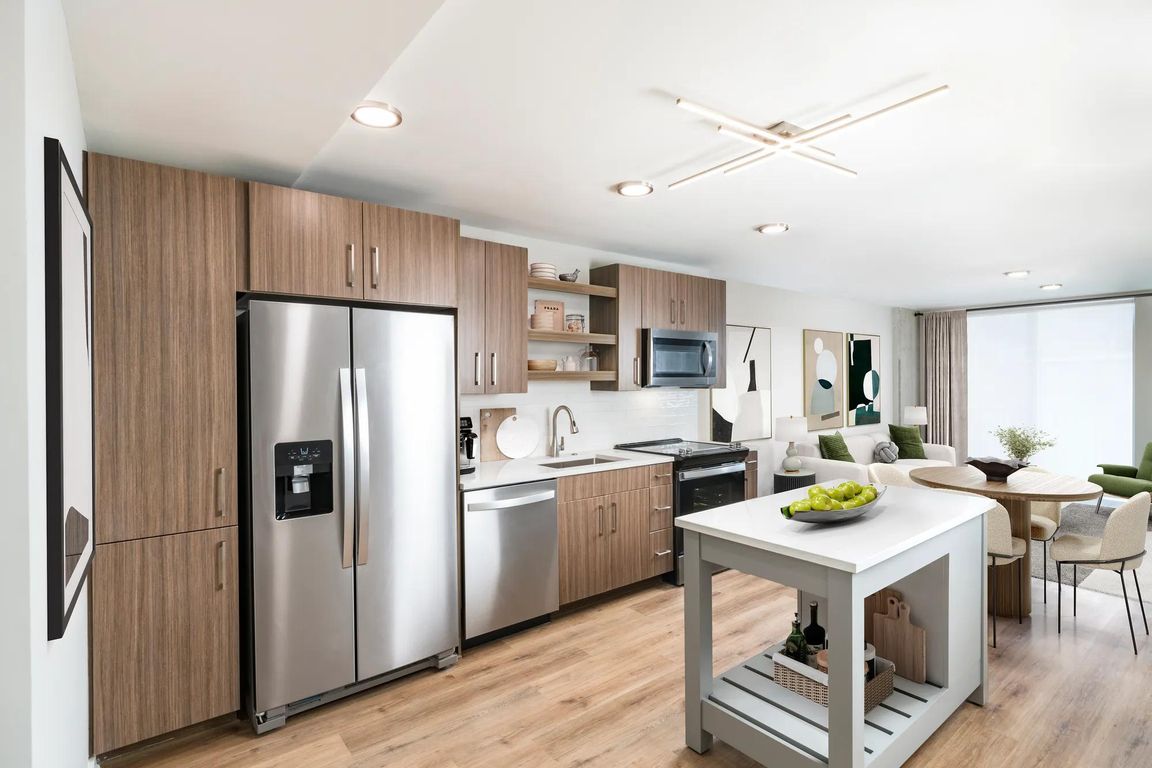 Large chef's island with built-in storage and ENERGY STAR_ stainless steel appliances.