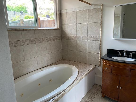 Master bath with jacuzzi spa tub