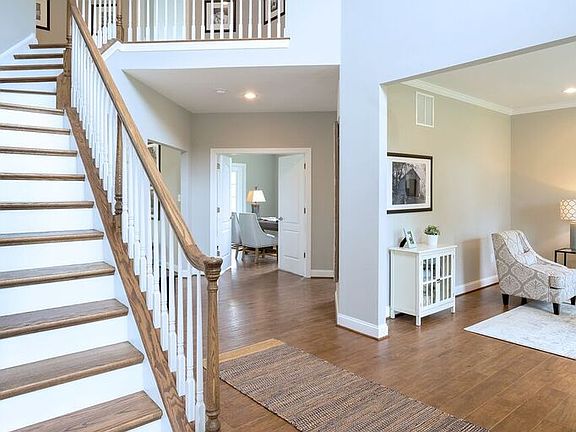 Front hallway with stairs leading up 410 Oxford Drive from hallmark homes