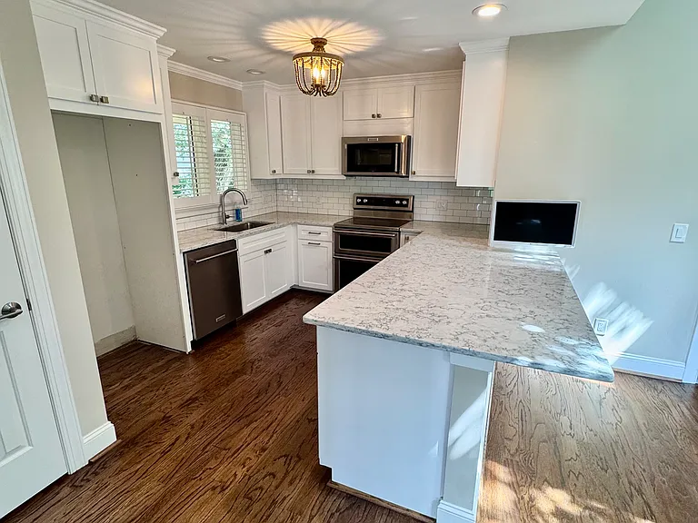 Kitchen with microwave double oven with quick-heating oven setup.
