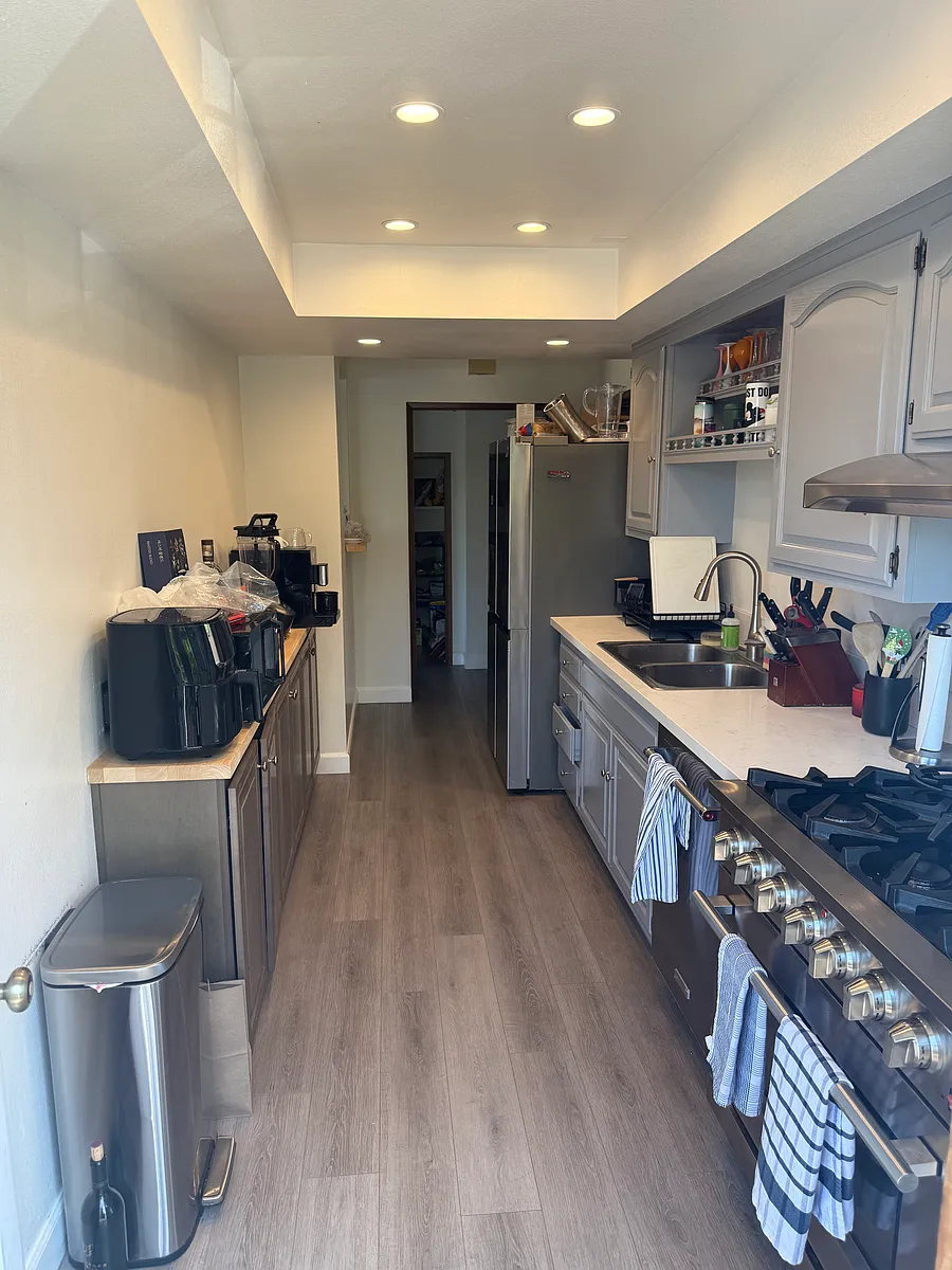 galley kitchen with fridge, dishwasher, oven, microwave - 355 E 16th St #C