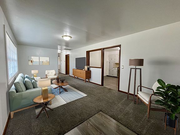 Living Room - Furniture is styled to show how modern furniture would look, but any style of furniture will make it homey.