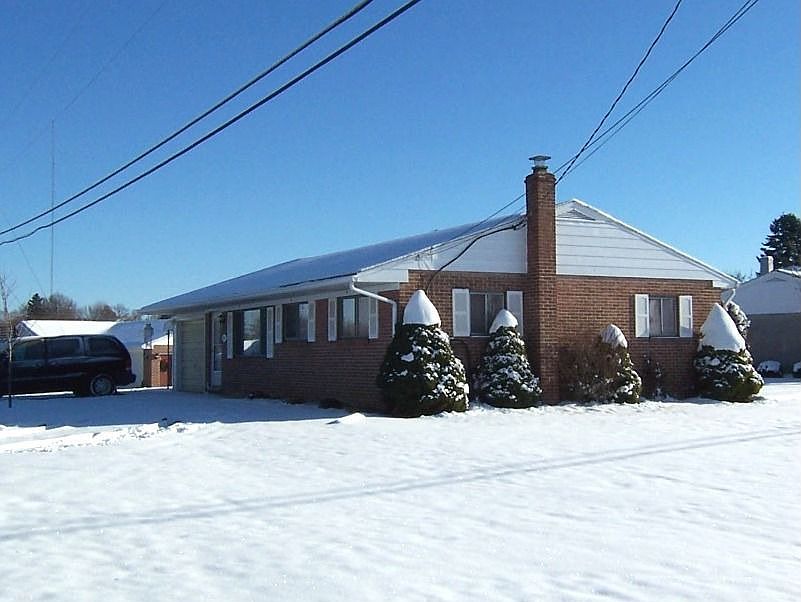 Pleasant brick ranch on corner lot