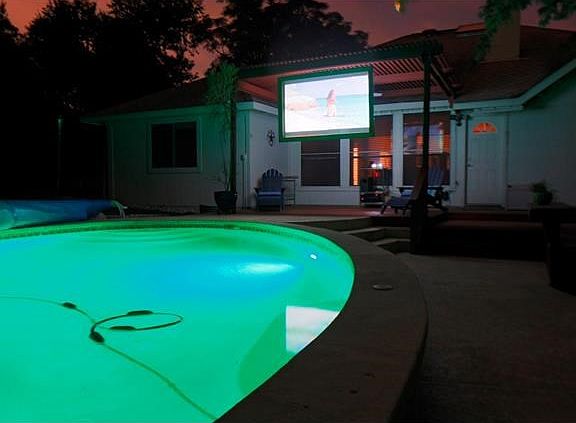 Movies can be projected on the screen after dark. Kids love it during summer break !!! The screen can be left with the house.