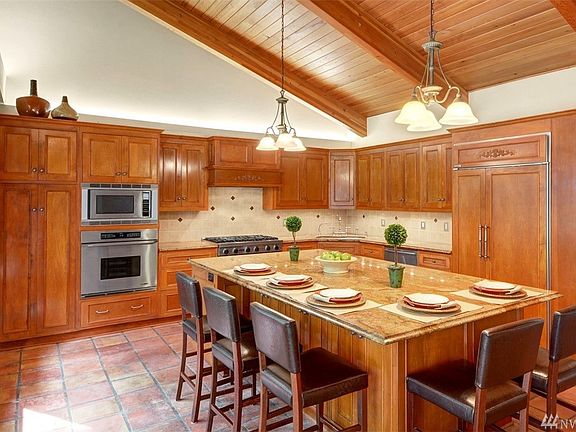 High end kitchen remodel with custom solid cherry cabinetry, slab granite and stainless steel appliances. 