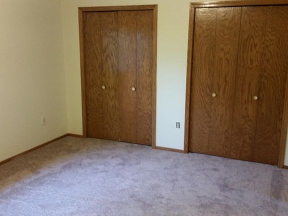 Double closets with adjustable shelves in master