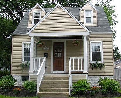 New front porch, landscaping, roof, siding, exterior doors & windows