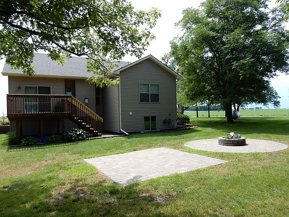 Backyard
						:
						Brick patio and brick firepit, sturdy 6" x 6"posts support deck