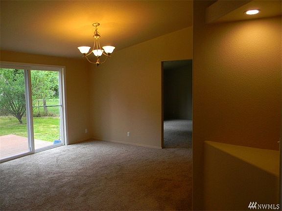 The dining area is just off the kitchen and features access to the backyard with a Trex Deck.