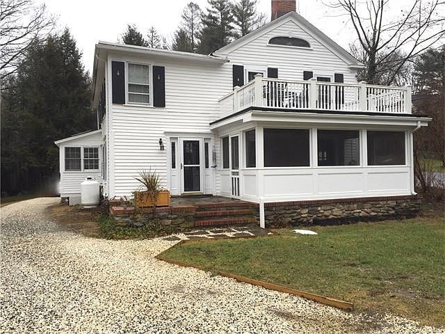 The front door of this 1763 colonial is around the back. The home was last updated in 2009 with new 